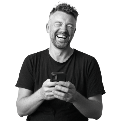 white-male-in-his-40s-holding-phone-happy-moment