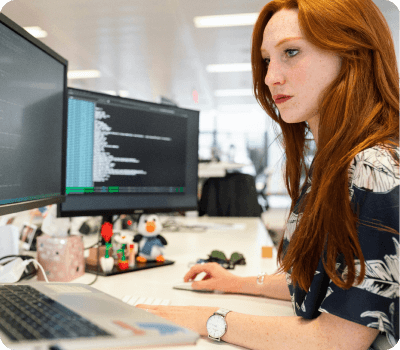 female-at-desk-looking-at-screen-computer-engineering